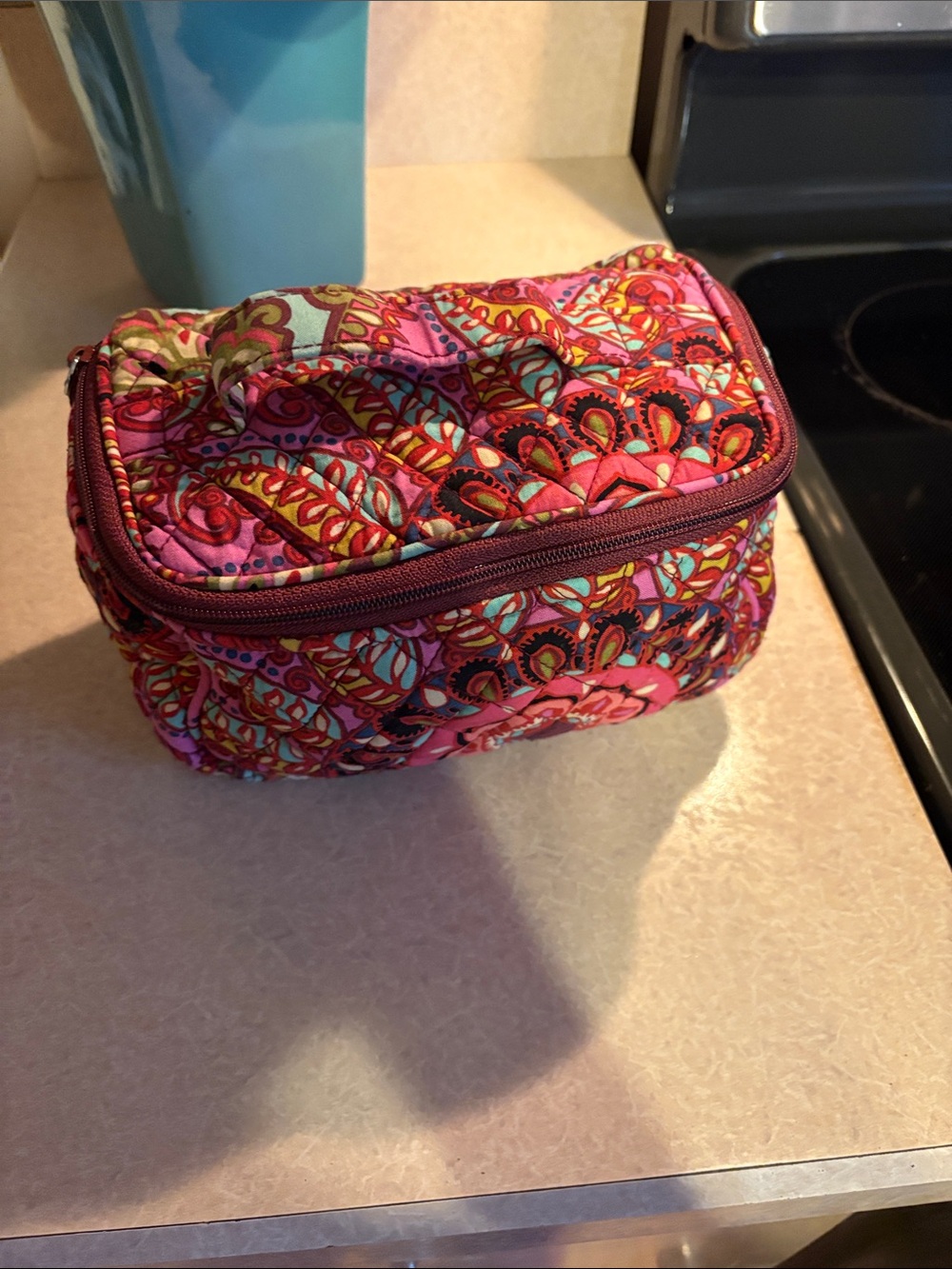 Makeup bag by Vera Bradley.